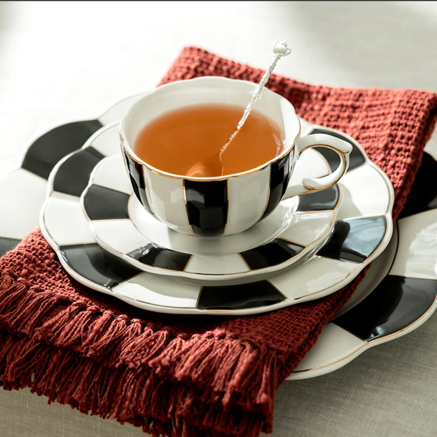 Black and White Striped Scallop Porcelain Tea Cup and Saucer with Gold Trim